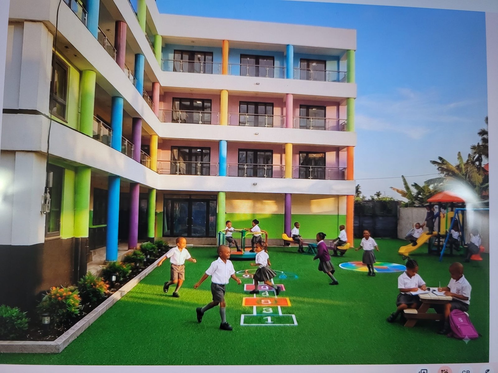 The EBLIS school building and playground, with pupils playing outside